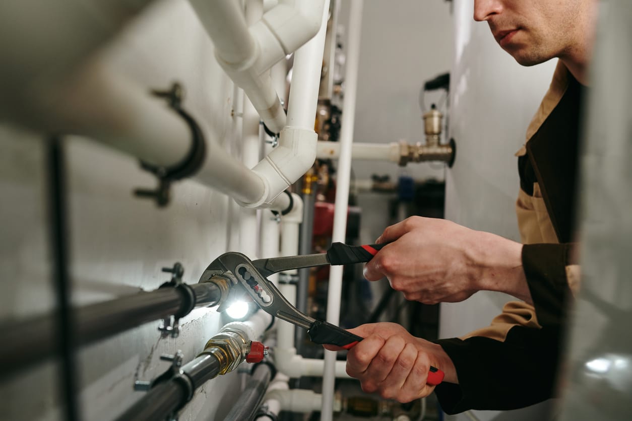Plumbers maintaining commercial plumbing pipes in Boca Raton